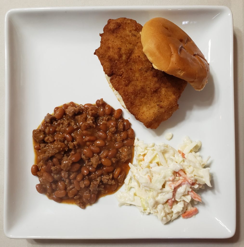 chicken burger with coleslaw and baked beans